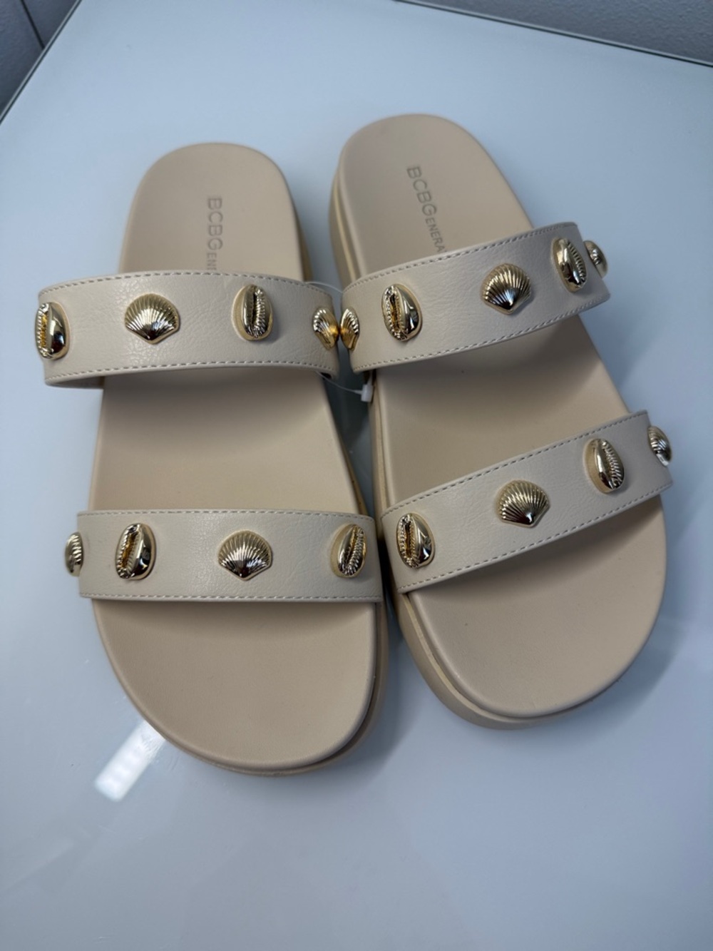 BCBGeneration Beige Slide Sandals with Gold Shell Studs